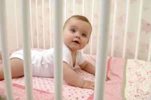 Baby in cot
